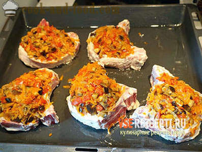 Pork steak with vegetables and cheese in the oven