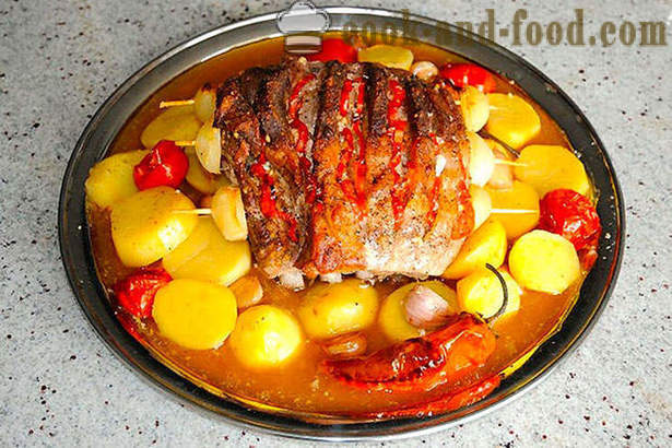 Roast pork loin with potatoes in the oven