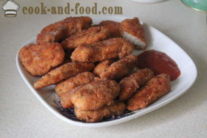 Nuggets of chicken breast breaded and fried in a pan - how to make chicken nuggets from the house, step by step recipe photos