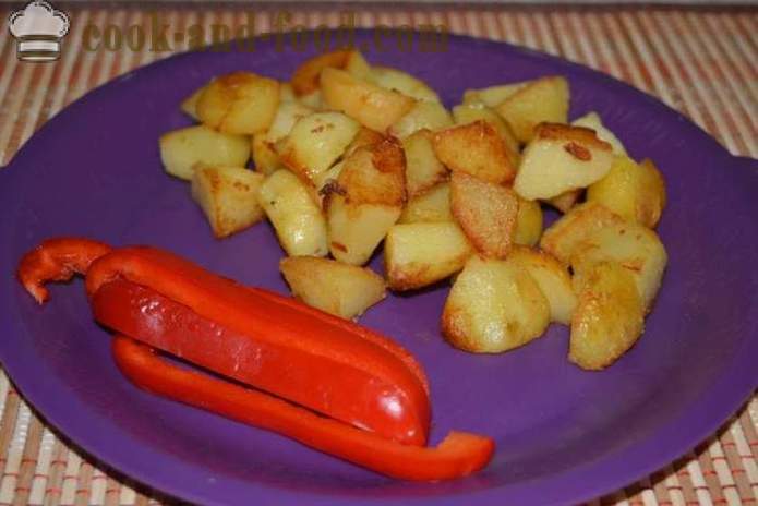 Boiled potatoes in their skins in a pan fried - delicious dish of boiled potatoes in their skins for garnish