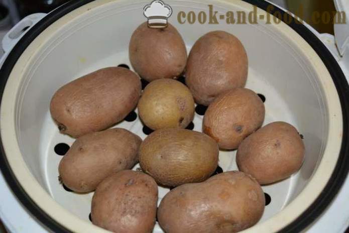 Boiled potatoes in their skins in a pan fried - delicious dish of boiled potatoes in their skins for garnish