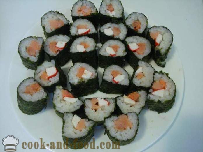 Sushi rolls with crab sticks and red fish - cooking sushi rolls at home, step by step recipe photos