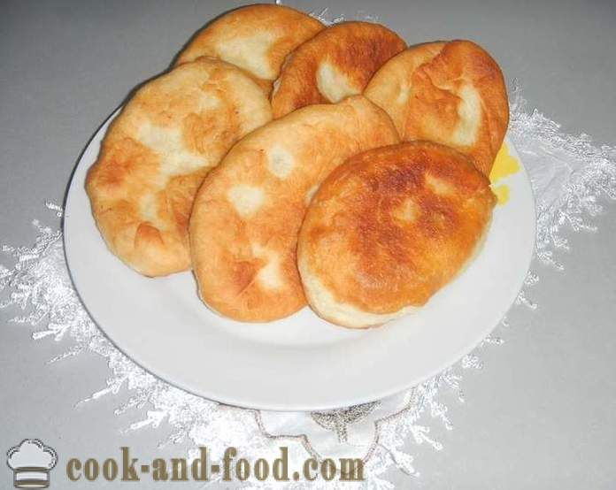 Yeast cakes with potatoes fried in a pan
