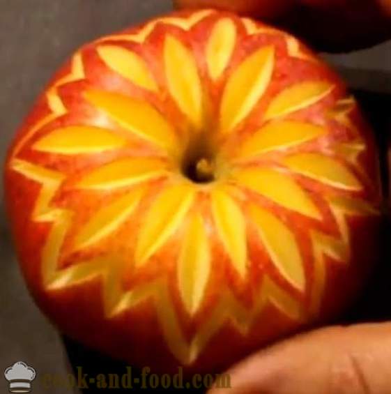 Fruit decorations for dishes, cake, table, or carving out of an apple with a photo, video